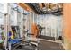 Unfinished basement with a dedicated gym area with workout machines and weights at 14707 Batteliere Dr, Charlotte, NC 28278