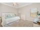 Bright bedroom with neutral tones, soft carpet, and natural light from windows at 14707 Batteliere Dr, Charlotte, NC 28278