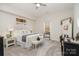 Charming bedroom with farmhouse decor, soft carpet, and a large window at 14707 Batteliere Dr, Charlotte, NC 28278