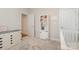 Neutral bedroom with white bookcase, dresser, and soft carpet at 14707 Batteliere Dr, Charlotte, NC 28278