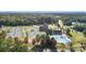 Aerial view of community pool, tennis courts, and clubhouse at 14707 Batteliere Dr, Charlotte, NC 28278