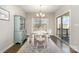 Dining room featuring a light-colored table, decorative rug, and blue hutch at 14707 Batteliere Dr, Charlotte, NC 28278