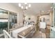 Open-concept dining room with a chandelier and a view into the kitchen and living area at 14707 Batteliere Dr, Charlotte, NC 28278