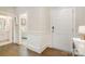 Inviting entryway with hardwood floors, white trim, and a view into the adjoining rooms with neutral walls at 14707 Batteliere Dr, Charlotte, NC 28278