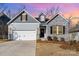 Charming single-Gathering home with a manicured front lawn and two-car garage at 14707 Batteliere Dr, Charlotte, NC 28278