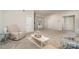 Large living room with neutral walls and carpet, featuring a coffee table at 14707 Batteliere Dr, Charlotte, NC 28278