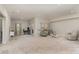 Expansive living room with light walls, neutral carpet, and recessed lighting at 14707 Batteliere Dr, Charlotte, NC 28278