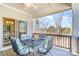 Covered porch with outdoor seating and views of the trees at 14707 Batteliere Dr, Charlotte, NC 28278