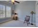 Bedroom featuring plantation shutters, a dark wood chair and lamp at 14830 Creeks Edge Dr, Charlotte, NC 28278