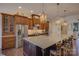 Well-appointed kitchen with stainless steel appliances, custom cabinetry, and a spacious island at 14830 Creeks Edge Dr, Charlotte, NC 28278