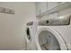 Bright laundry room with front-load washer and dryer at 14830 Creeks Edge Dr, Charlotte, NC 28278