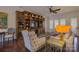 Elegant living room with custom built-ins, including wine storage and display shelving at 14830 Creeks Edge Dr, Charlotte, NC 28278