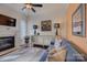 Cozy living room with fireplace, built-in shelving, and comfortable seating at 14830 Creeks Edge Dr, Charlotte, NC 28278
