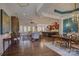 Open concept living and dining area with hardwood floors and neutral color palette at 14830 Creeks Edge Dr, Charlotte, NC 28278
