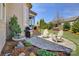 Inviting outdoor patio area with a grill, water feature, and comfortable seating for outdoor enjoyment at 14830 Creeks Edge Dr, Charlotte, NC 28278