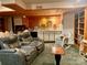 Relaxing basement space with recliner chairs, a built-in bar with shelving, and a cozy reading nook at 1496 Givens St, Hickory, NC 28602