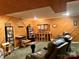 Spacious basement with wood walls, comfortable leather seating, and custom wood bookcases at 1496 Givens St, Hickory, NC 28602