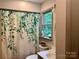 Bathroom featuring a floral shower curtain at 1496 Givens St, Hickory, NC 28602