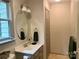 Bathroom featuring a sink and an oval mirror at 1496 Givens St, Hickory, NC 28602