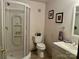 Bathroom with a shower, neutral walls, modern vanity, toilet, framed art, and a towel rack at 1496 Givens St, Hickory, NC 28602