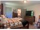 Well-lit bedroom featuring a bathroom doorway, tv, and dresser at 1496 Givens St, Hickory, NC 28602