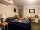 Comfortable bedroom featuring cozy bedding, a desk, and soft lighting, creating a welcoming and relaxing space at 1496 Givens St, Hickory, NC 28602
