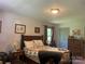 Bedroom showcasing wood furniture, warm tones, and a peaceful retreat setting at 1496 Givens St, Hickory, NC 28602