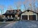 Charming two-story home featuring a welcoming front porch and a two car garage at 1496 Givens St, Hickory, NC 28602
