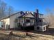 Back view of the house with a deck and propane tank at 1496 Givens St, Hickory, NC 28602