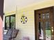 Charming front porch featuring a swing and wooden door, perfect for enjoying the outdoors at 1496 Givens St, Hickory, NC 28602