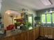 Kitchen featuring a stone fireplace and a breakfast bar overlooking the living room at 1496 Givens St, Hickory, NC 28602