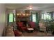 Warm living room showcases a stone fireplace, arched doorway, and traditional decor with a cozy ambiance at 1496 Givens St, Hickory, NC 28602