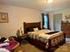 Comfortable main bedroom with wooden furniture, natural light, and a cozy quilt at 1496 Givens St, Hickory, NC 28602