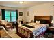 Inviting main bedroom with a natural light, a cozy quilt, and seating area at 1496 Givens St, Hickory, NC 28602