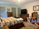 Spacious main bedroom with natural light, dresser, TV, and neutral carpet at 1496 Givens St, Hickory, NC 28602