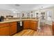 Open kitchen featuring wooden cabinets, a breakfast bar, and easy access to dining area at 2003 Savoy Ct, Indian Trail, NC 28079