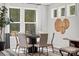 Dining room with stylish table setting and lots of natural light from large windows at 3009 Tramore Dr, Harrisburg, NC 28075