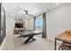 Spacious recreation room with a sleek ping pong table and entertainment setup at 3009 Tramore Dr, Harrisburg, NC 28075