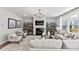 Bright living room with a fireplace, built-in shelving, and comfortable furnishings at 3009 Tramore Dr, Harrisburg, NC 28075