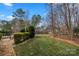 Expansive backyard with lush landscaping, mature trees and stone walking path at 3019 Foggy Hollow Ln, Clover, SC 29710