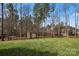 Large, level backyard with mature trees and storage shed at 3019 Foggy Hollow Ln, Clover, SC 29710
