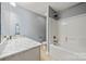 This lovely bathroom has a shower/tub combo, gray walls, and a granite countertop vanity at 3019 Foggy Hollow Ln, Clover, SC 29710