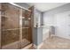 Bathroom showcasing a tiled shower, a separate tub, and a window for natural light at 3019 Foggy Hollow Ln, Clover, SC 29710