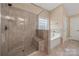 Bathroom featuring shower with bench seating, garden tub and neutral tile at 3019 Foggy Hollow Ln, Clover, SC 29710
