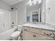 This sleek bathroom features a shower/tub combo, granite countertop vanity, and vanity mirror at 3019 Foggy Hollow Ln, Clover, SC 29710