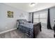 This charming bedroom is complete with gray carpet, blue bedding, and window letting in natural light at 3019 Foggy Hollow Ln, Clover, SC 29710