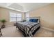 This relaxing bedroom features plush carpet, windows for natural light, and neutral colored walls at 3019 Foggy Hollow Ln, Clover, SC 29710