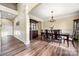 Spacious dining room with hardwood floors, chandelier, and built-in display cabinet at 3019 Foggy Hollow Ln, Clover, SC 29710