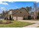 Charming two-story home with a well-manicured lawn and attached two-car garage at 3019 Foggy Hollow Ln, Clover, SC 29710