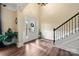 Elegant foyer with hardwood floors, staircase, and ample natural light at 3019 Foggy Hollow Ln, Clover, SC 29710